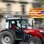 A farmer carries a Catalan separatist flag on his tractor during a protest to show support for the banned referendum on independence from Spain in Barcelona, Spain September 29, 2017. REUTERS/Juan Medina