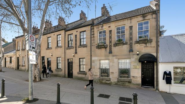 The small inner-city street where three houses are all for sale