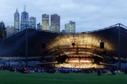 With Melbourne's skyline as backdrop, spectators arrive for a concert at the Sidney Myer Music Bowl in 2001. 