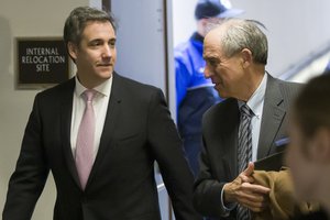 Michael Cohen, left, President Donald Trump’s former lawyer, arrives to testify before a closed door hearing of the Senate Intelligence Committee accompanied by his lawyer Lanny Davis of Washington, on Capitol Hill, Tuesday, Feb. 26, 2019, in Washington.