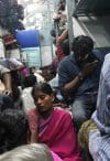 Migrant workers returning home in a train in Cochin, India.