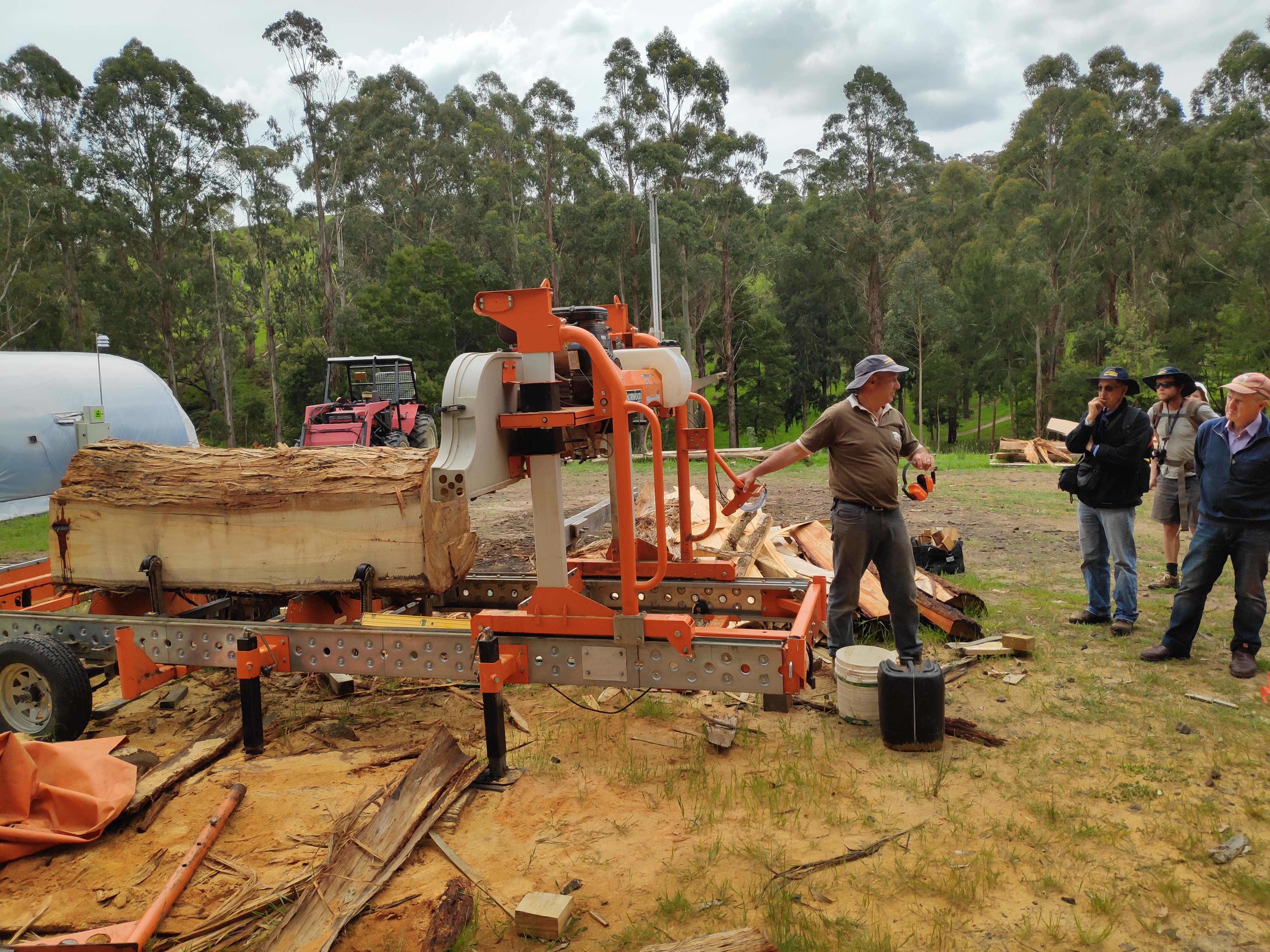 Sawmill being used to saw wood