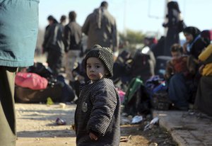 A young Syrian child evacuated from the embattled Syrian city of Aleppo during the ceasefire arrives at a refugee camp in Rashidin, near Idlib, Syria, early Monday, Dec. 19, 2016.