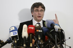 Former Catalan leader Carles Puigdemont attends a news conference in Berlin, Germany, Tuesday, Feb. 12, 2019.