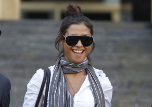 FILE - In this Monday, Oct. 3, 2011 file photo, Imane Fadil smiles as she leaves the court in Milan, Italy.