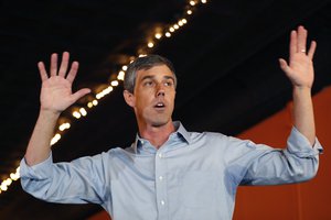 Former Texas congressman Beto O'Rourke speaks to local residents during a stop at the Central Park Coffee Company, Friday, March 15, 2019, in Mount Pleasant, Iowa.