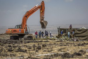 Investigators continue recovery work at the scene where the Ethiopian Airlines Boeing 737 Max 8 crashed shortly after takeoff on Sunday killing all 157 on board, near Bishoftu, south-east of Addis Ababa, in Ethiopia, Friday, March 15, 2019