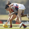 Angela Foley tackles Tegan Cunningham.