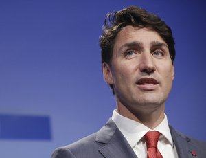 Canadian Prime Minister Justin Trudeau speaks at a press conference after a summit of heads of state and government at NATO headquarters in Brussels, Belgium, Thursday, July 12, 2018. NATO leaders gather in Brussels for a two-day summit.