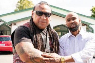 Mongrel Mob Waikato president Sonny Fatu with Hanad Ibrahim from Jamia Mosque in Hamilton.