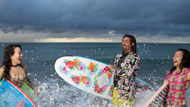 Grant Trebilco, founder of surfing mental health group One Wave, with Dabriella (left) and Aprilla Quayle, at Bondi Beach. 