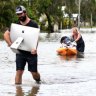 Local residents salvage items from their flood-affected home in the suburb of Hermit Park in Townsville on February 6, 2019. 