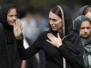 New Zealand Prime Minister Jacinda Ardern waves as she leaves Friday prayers at Hagley Park in Christchurch, New Zealand, Friday, March 22, 2019.