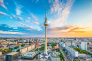 H3AR2F Berlin skyline panorama with famous TV tower at Alexanderplatz and dramatic clouds at sunset, Germany Traveller ALAMY
