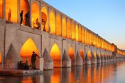 Khaju Bridge / Khajoo bridge over Zayandeh river at dusk with lights, Isfahan, Iran