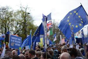 Flags and placards at the anti-Brexit People's Vote march, London, England, 23 March 2019.