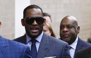 Musician R. Kelly arrives at the Daley Center for a hearing in his child support case at the Daley Center, Wednesday, March 6, 2019, in Chicago