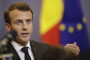 French President Emmanuel Macron speaks at the end of an EU summit in Brussels, Friday, March 22, 2019.