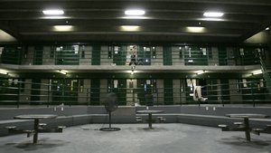 Correctional Officer Max Nelson makes the rounds,every 30 minutes, checking on inmates in the segregation unit for suicide attempts, at California State Prison, Sacramento, in Folsom, Calif., Friday, March 30, 2007.