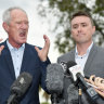 One Nation party officials Steve Dickson (left) and James Ashby field questions during a press conference in Brisbane, Tuesday, March 26, 2019. The pair have been caught in an al-Jazeera investigation which used hidden cameras and a journalist posing as a grassroots gun campaigner to expose the far-right party's extraordinary efforts to secure funding in Washington DC in September.