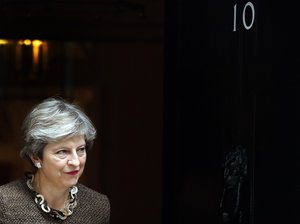 British Prime Minister Theresa May walks out at 10 Downing Street to meet European Council President Donald Tusk in London, Tuesday, Sept. 26, 2017.