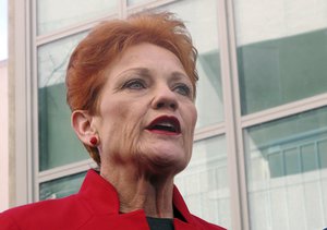 One Nation party senator Pauline Hanson addresses the media at Parliament House in Canberra, Australia, on Thursday, June 21, 2018, after voting in support of tax reform.