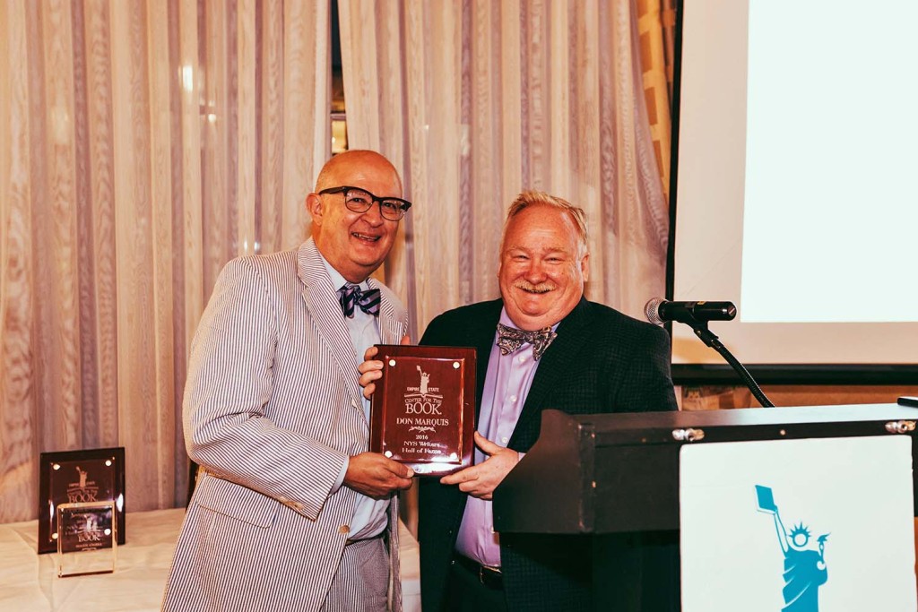 Rocco Staino, left, and John Batteiger with Don Marquis's Hall of Fame award.