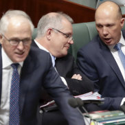 Treasurer Scott Morrison speaks with Minister for Home Affairs Peter Dutton as Prime Minister Malcolm Turnbull speaks during Question Time at Parliament House in Canberra on Monday 20 August 2018. 