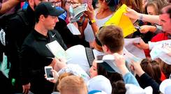 There’s no doubting the main attraction in Portstewart as Rory McIlroy signs autographs for fans at yesterday’s Pro-Am. Photo: Niall Carson/PA Wire