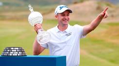 Scotland's Russell Knox celebrates with the trophy