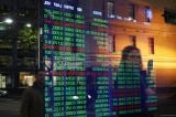 Australian shares recovered from a $20 billion sell-off on Monday to close the week relatively flat.