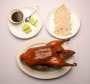 The signature Peking duck is presented tableside, then whisked off and assembled into pancakes.