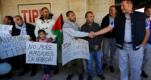 TIPH shakes hands with Palestinian man welcoming him to Hebron