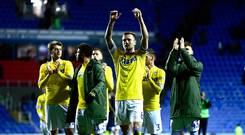 READING, ENGLAND - MARCH 12: Leeds Captain Liam Cooper celebrates with his team after winning the Sky Bet Championship match between Reading and Leeds United at the Madejski Stadium on March 12, 2019 in Reading, England. (Photo by Jordan Mansfield/Getty Images)