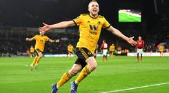 WOLVERHAMPTON, ENGLAND - MARCH 16: Diogo Jota of Wolverhampton Wanderers (R) celebrates after scoring his team's second goal during the FA Cup Quarter Final match between Wolverhampton Wanderers and Manchester United at Molineux on March 16, 2019. (Photo by Michael Regan/Getty Images)