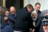Julian Assange is bundled out of the Ecuadorian embassy by London police.