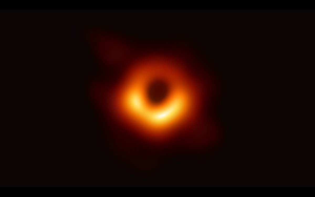 A glowing ring, brighter on the bottom, with a dark region in the middle