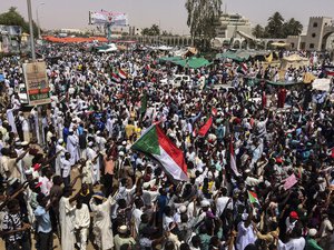 Demonstrators gather in Sudan's capital of Khartoum, Friday, April 12, 2019.