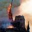 The steeple of the landmark Notre-Dame Cathedral collapses as the cathedral is engulfed in flames in central Paris on April 15, 2019.