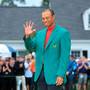 Tiger Woods smiles after being awarded the Green Jacket. Photo: Getty