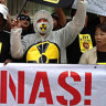 Malaysians gather outside Lynas Corporations Annual General Meeting in Sydney on Tuesday, to oppose the company's rare earth processing plant in Kuantan. Image lauren farrow  AAP