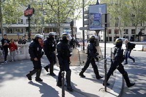 Police patrol around Place de la Madeleine prior to yellow vest demonstration in Paris, Saturday, April 20, 2019.