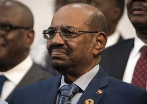 FILE - In this June 14, 2015 file photo, Sudanese President Omar al-Bashir smiles during a visit to Johannesburg, South Africa. South Africa's withdrawal from the International Criminal Court has been revoked, the United Nations secretary-general says, stalling what would have been the first-ever departure from the tribunal that pursues the world's worst atrocities