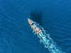 ESCAPE: A-Z TRAVEL_C IS FOR CRUISING, Kendall Hill - 24FEB19. Yacht at the sea in Europe. Aerial view of luxury floating ship at sunset. Colorful landscape with boat in marina bay, blue sea. Top view from drone of yacht. Luxury cruise. Seascape with motorboat Picture: iStock