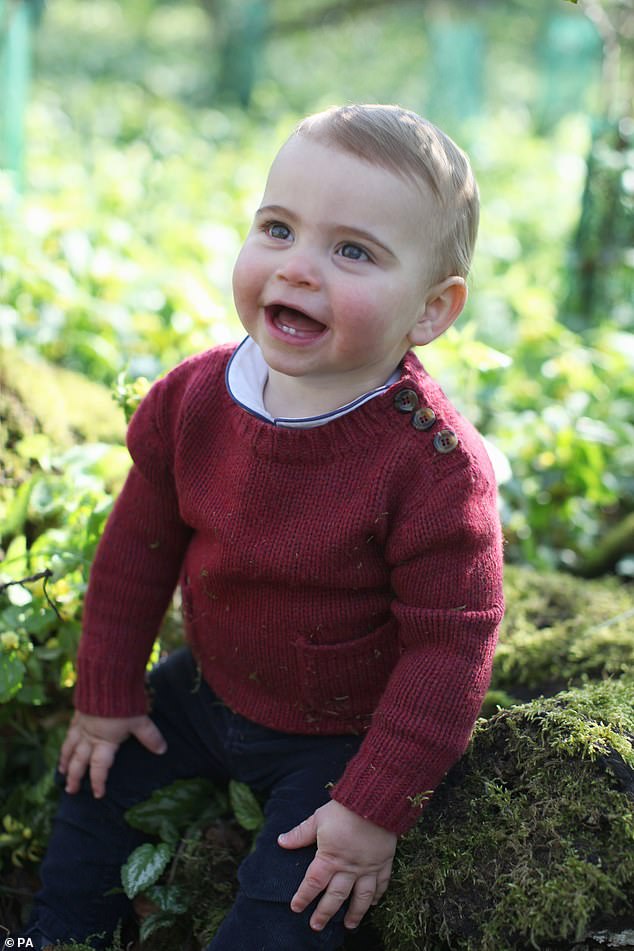 Louis, pictured, wore a knitted red jumper with tortoiseshell buttons on the shoulder and pockets on the front, with a white collared top underneath in the other two newly released photographs