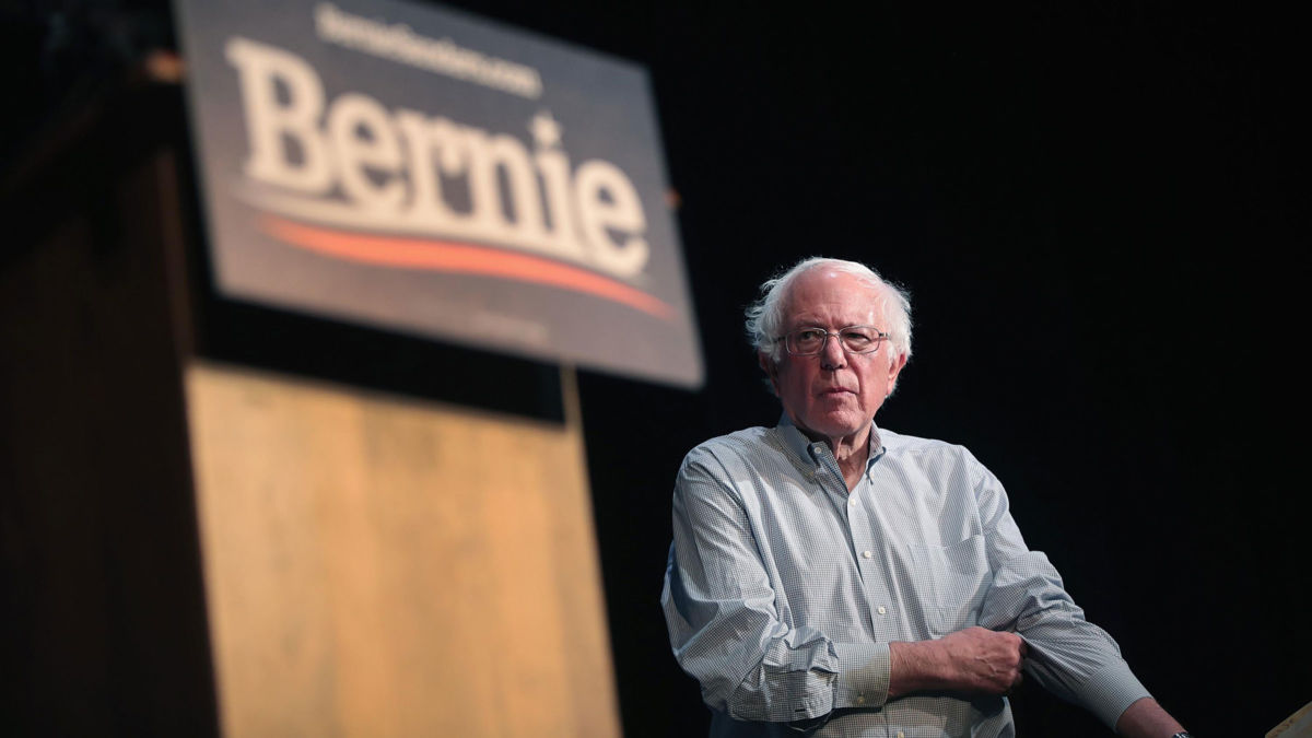 Democratic presidential candidate Sen. Bernie Sanders approaches podium at rally