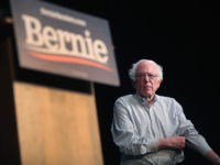 Democratic presidential candidate Sen. Bernie Sanders approaches podium at rally