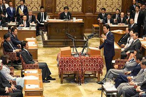 File - Prime Minister Abe on May 20, 2015, at the Joint Committee of the National Basic Policy Committee, with all the ministers in attendance at the National Diet Building in Chiyoda Ward, Tokyo, Japan, May 20, 2015.