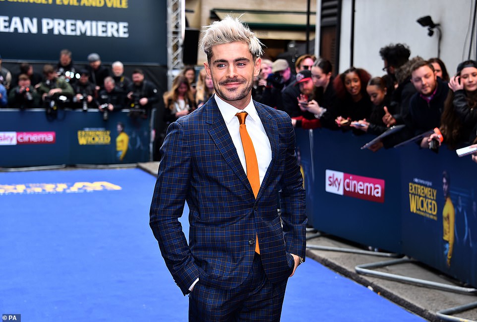 Bold hairdo: Zac styled his bold peroxide blonde locks into a textured quiff as he posed up a storm on the red carpet and smiled for pictures with his adoring fans