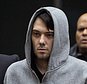 FILE - In this Dec. 17, 2015, file photo, Martin Shkreli, the former hedge fund manager under fire for buying a pharmaceutical company and ratcheting up the price of a life-saving drug, is escorted by law enforcement agents in New York, after being taken into custody following a securities probe. Pharmaceutical honcho Shkreli has been banished to solitary confinement amid allegations he was running his drug company from federal prison using a contraband smartphone, a person familiar with the matter told The Associated Press. (AP Photo/Craig Ruttle, File)